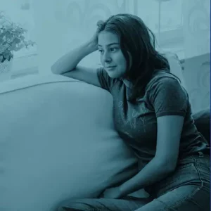 girl sitting on a couch listening intently