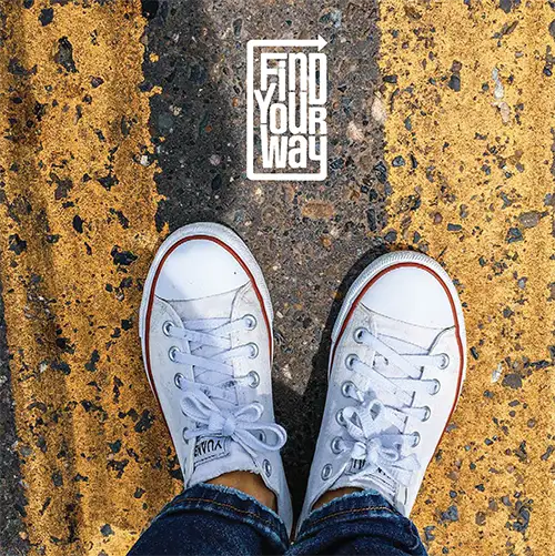 photo of shoes on a painted road w/find your way logo