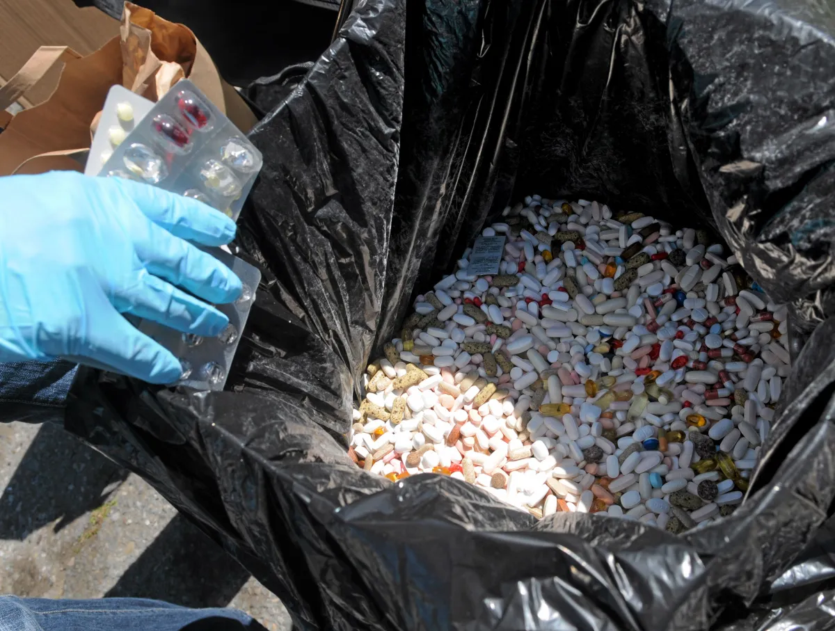 safe disposal of medication; hundreds of unused prescription medication disposed of in a garbage bag